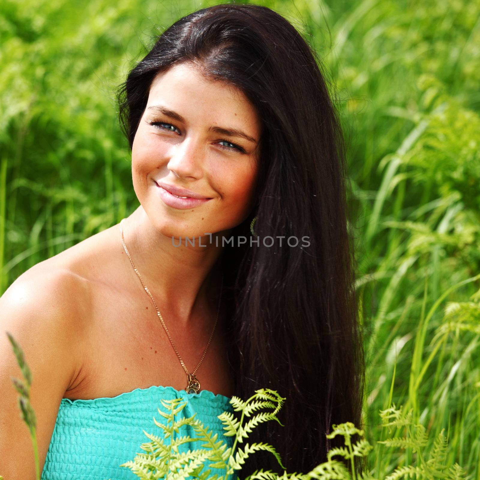 woman on flower field close portrait