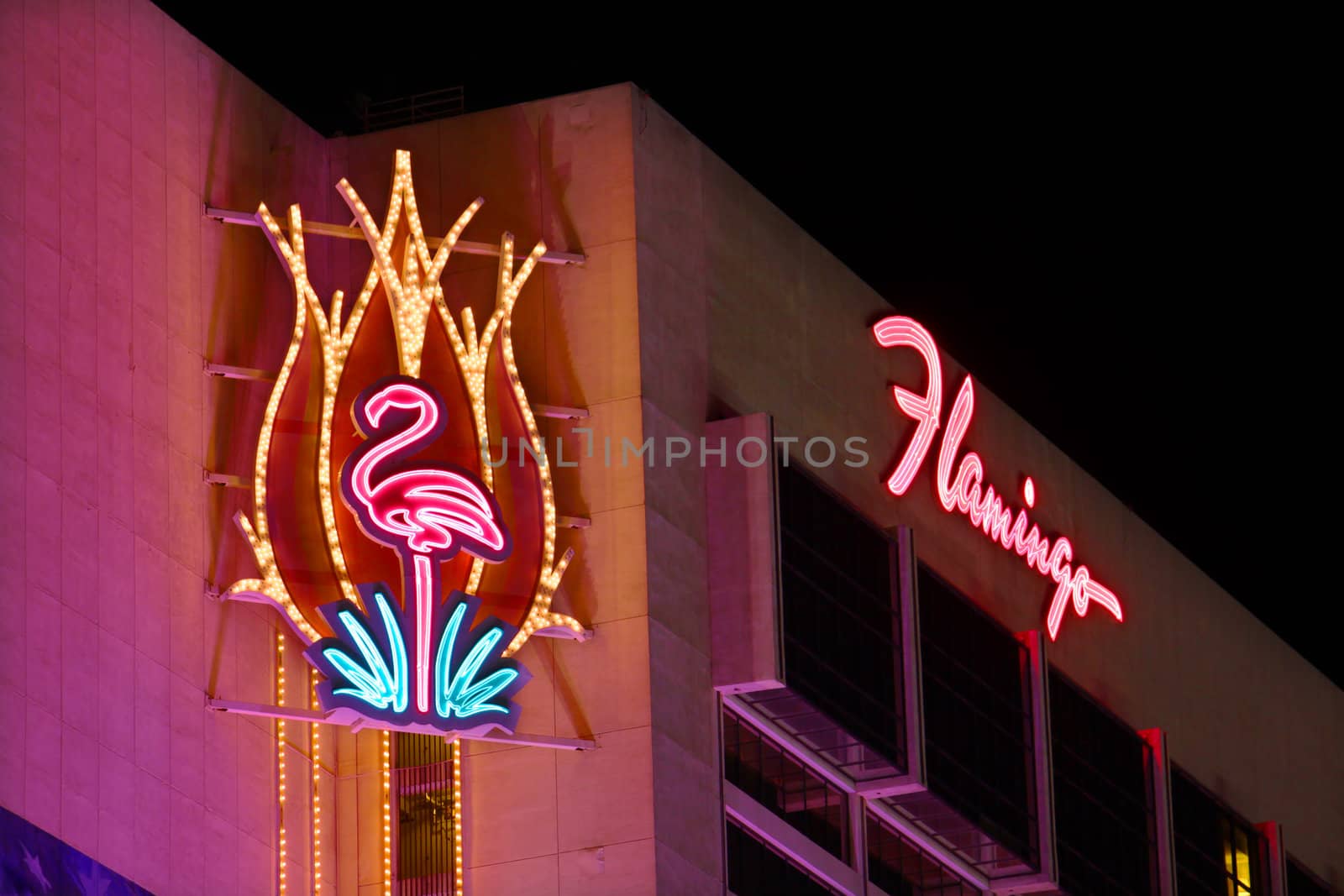 Las Vegas, USA - November 30, 2011: The Flamingo Las Vegas is a hotel and casino located on the famous Las Vegas Strip and has a art deco theme.  Seen here is the top portion of the hotel building with decorative neon signs.