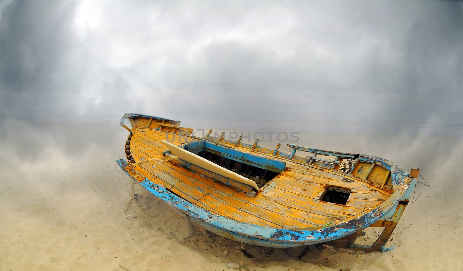 Deserted boat on a beach in Hammamet, Tunisia