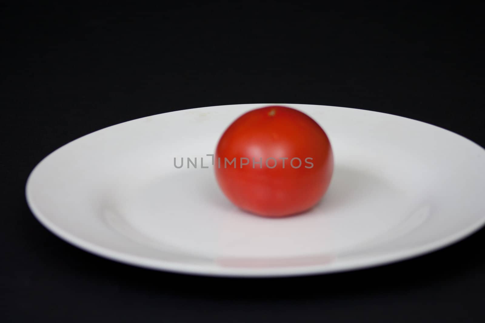 Red Tomatoe on a Plate by rothphotosc