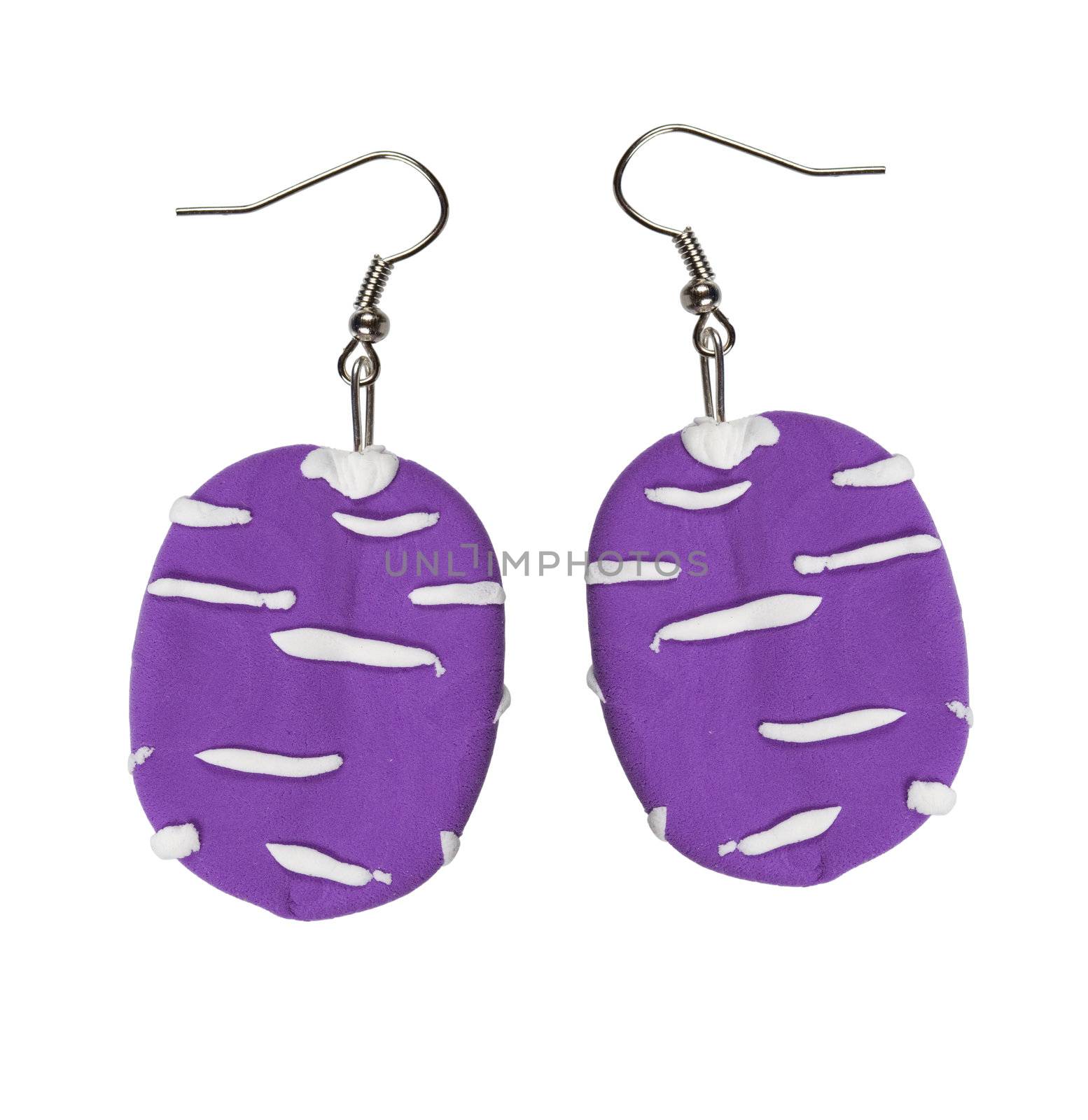 Earrings lilac color of the plastic clay isolated on a white background. collage