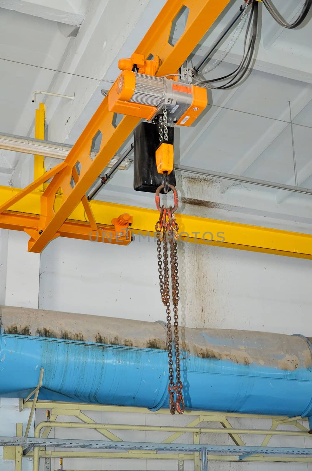 Automatic industrial crane at the plant