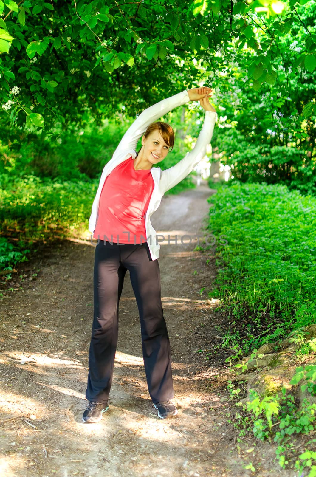 Attractive young woman stretching before Run