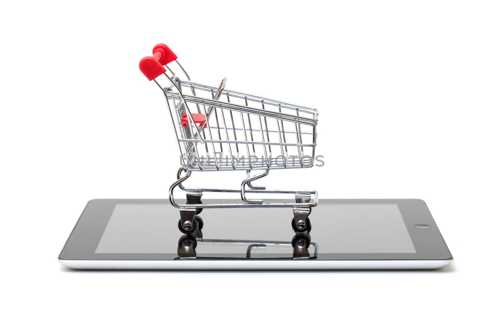 Shopping Cart over a Tablet PC on white background