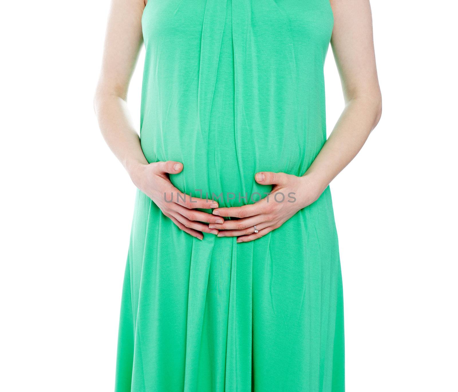 Cropped image of pregnant woman in green dress