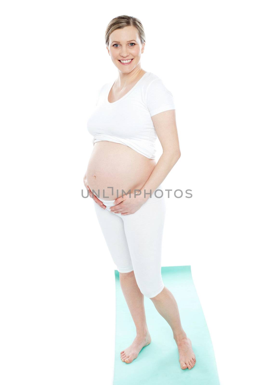 Image of pregnant woman touching her belly with hands