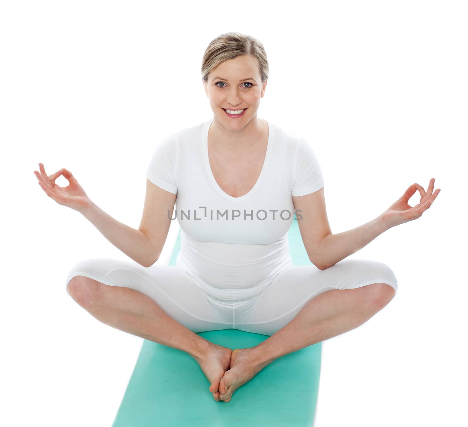 Attractive pregnant female doing exercise against white background