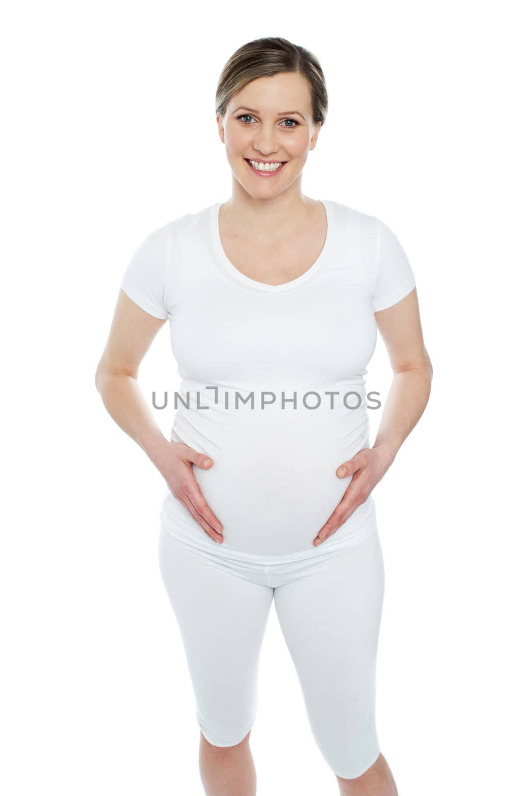 Photo of pregnant woman holding her tummy isolated over white background