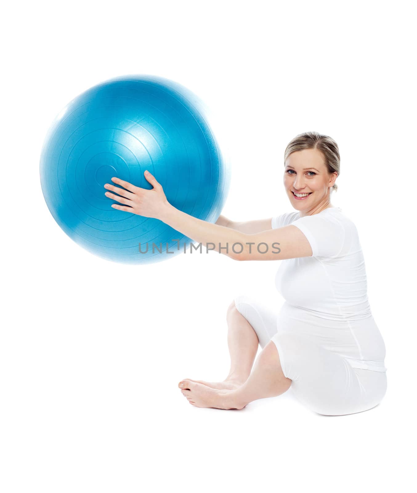 Beautiful pregnant woman sitting with exercise ball isolated on white background