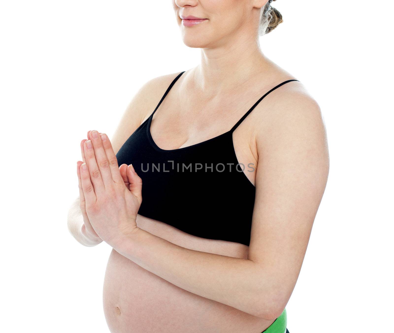 Cropped image of a pregnant female welcoming you