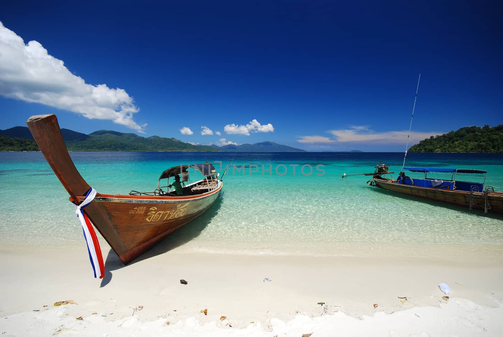 local long-tail boat on a beach in Andaman Sea, southern Thailand