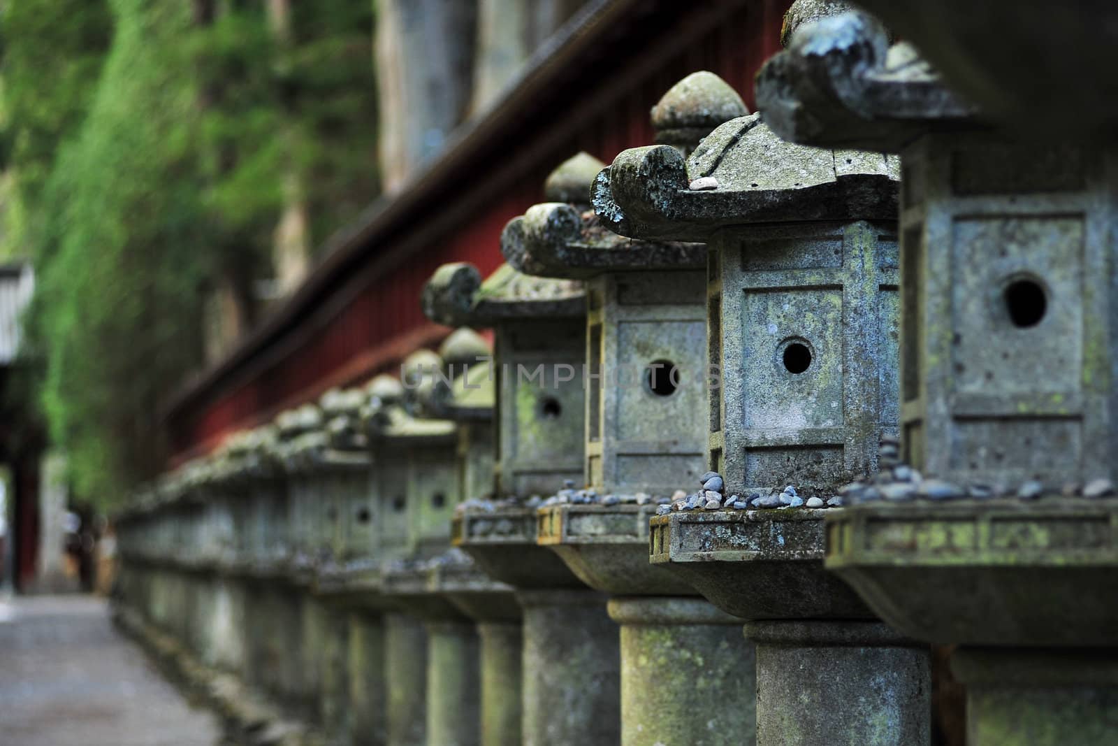 old japanese stone lantern row in a temple