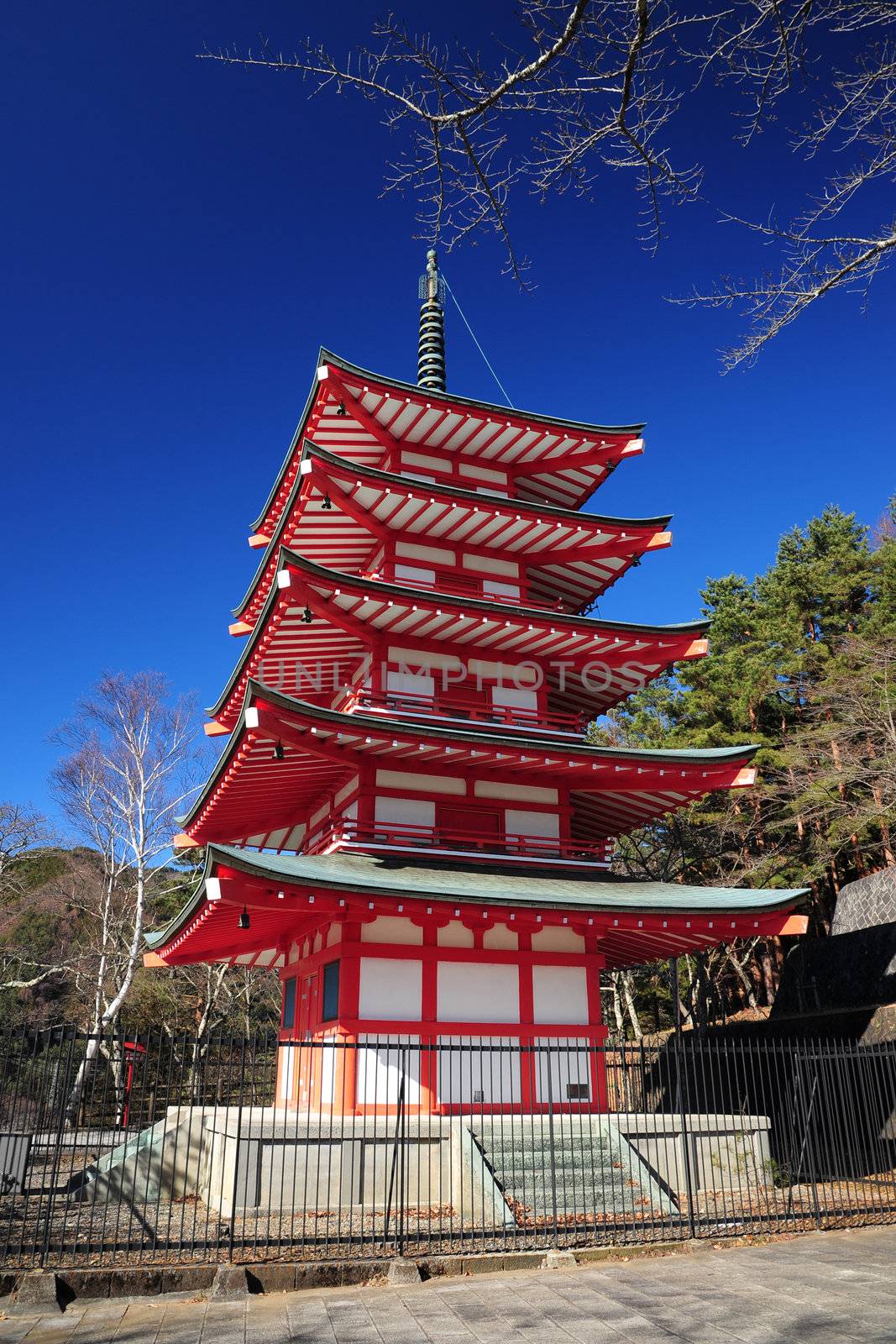Red five-stacked Japanese pagoda with blue sky in Winter