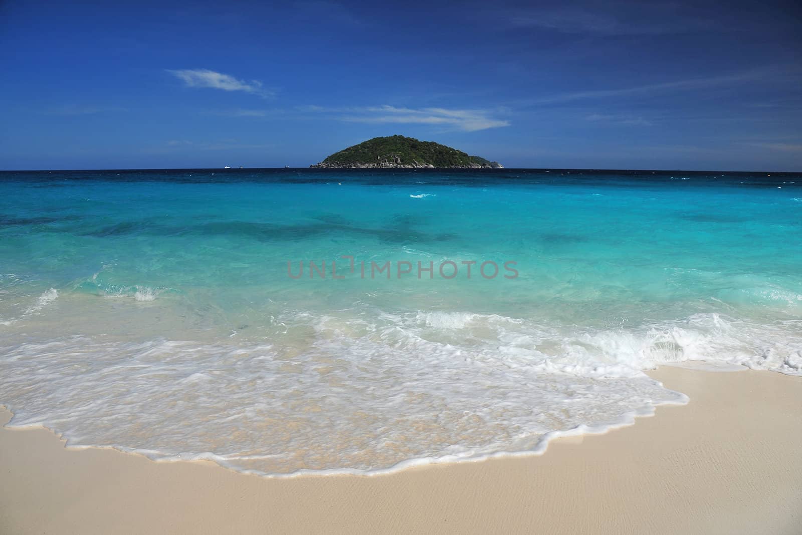 white sand beach with island in a turquoise sea, from andaman sea, thailand