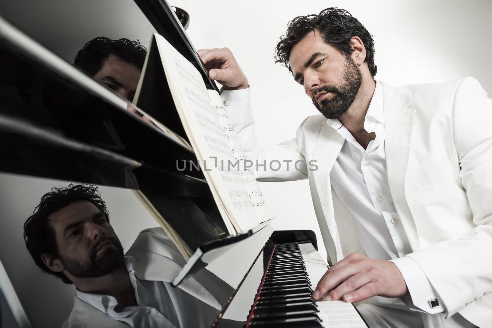 An image of a handsome man playing the piano