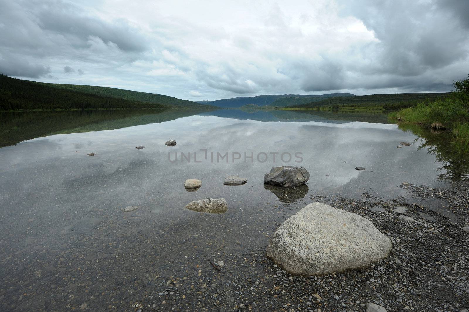 stone on wonder lake shore, denali national park