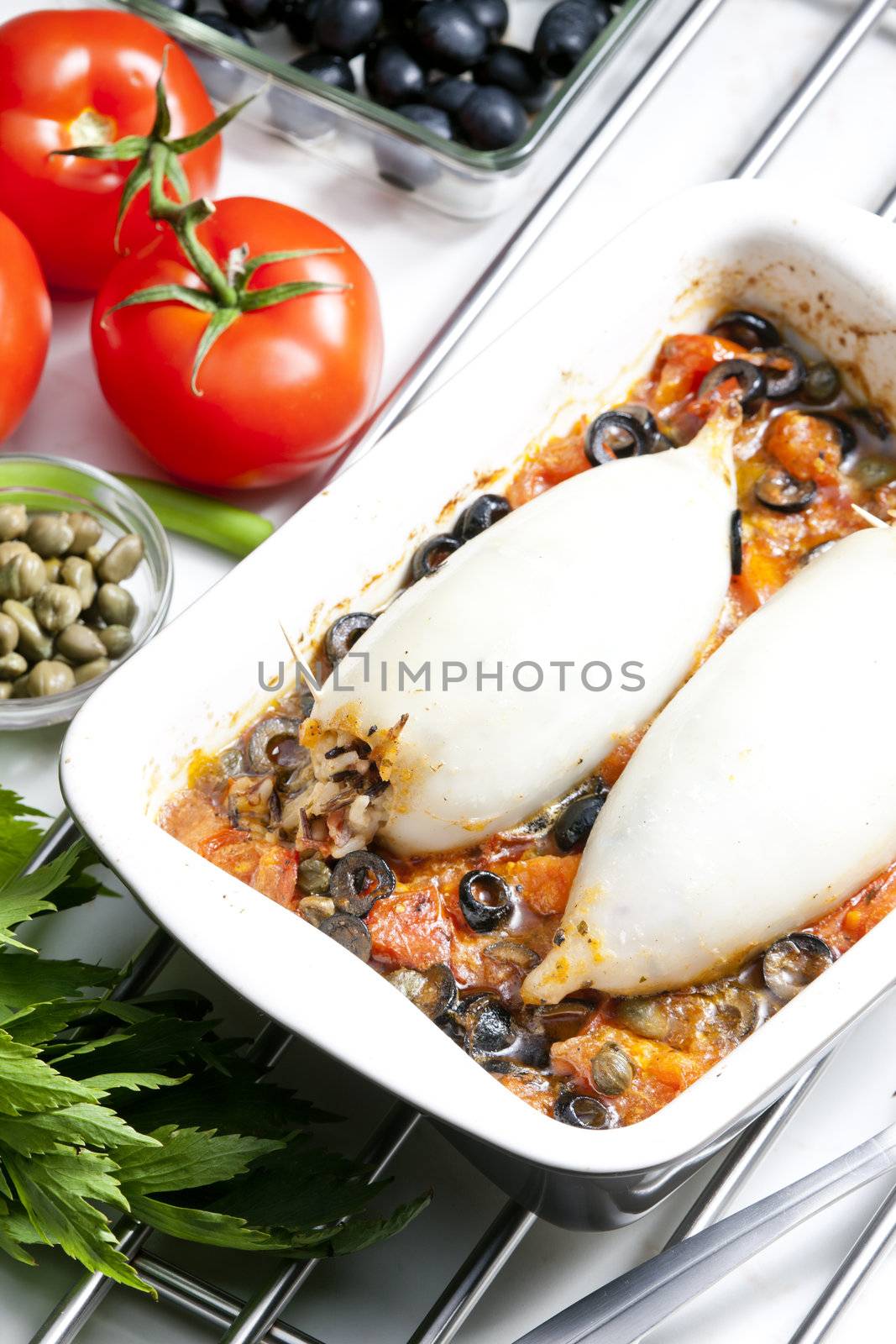 baked sepia with tomatoes and black olives filled with pearl bar by phbcz