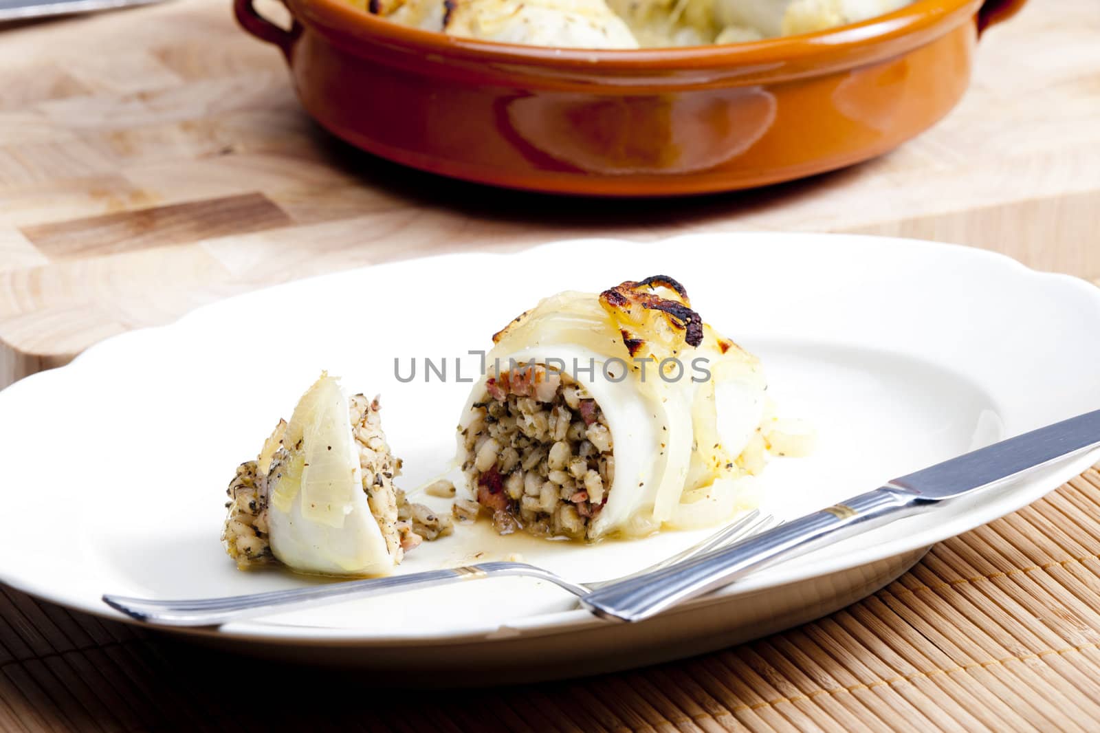 sepia filled with pearl barley baked with onion