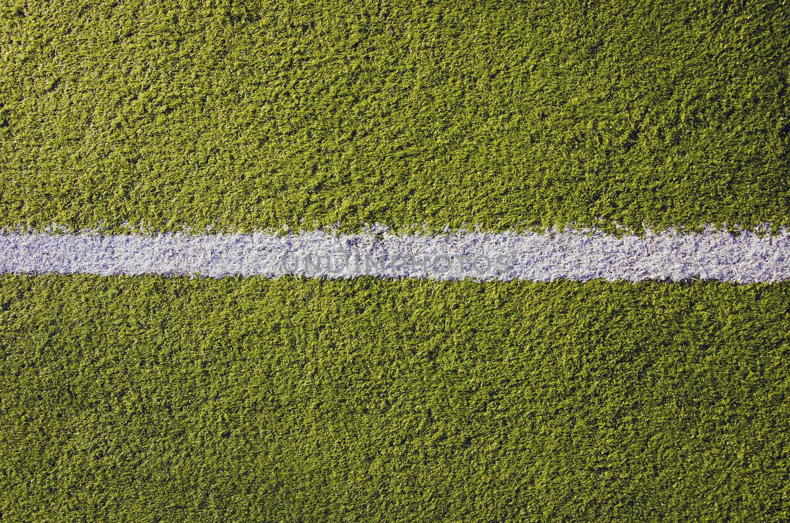 Synthetic sports pitches athletic green surface and white markings closeup background backdrop.