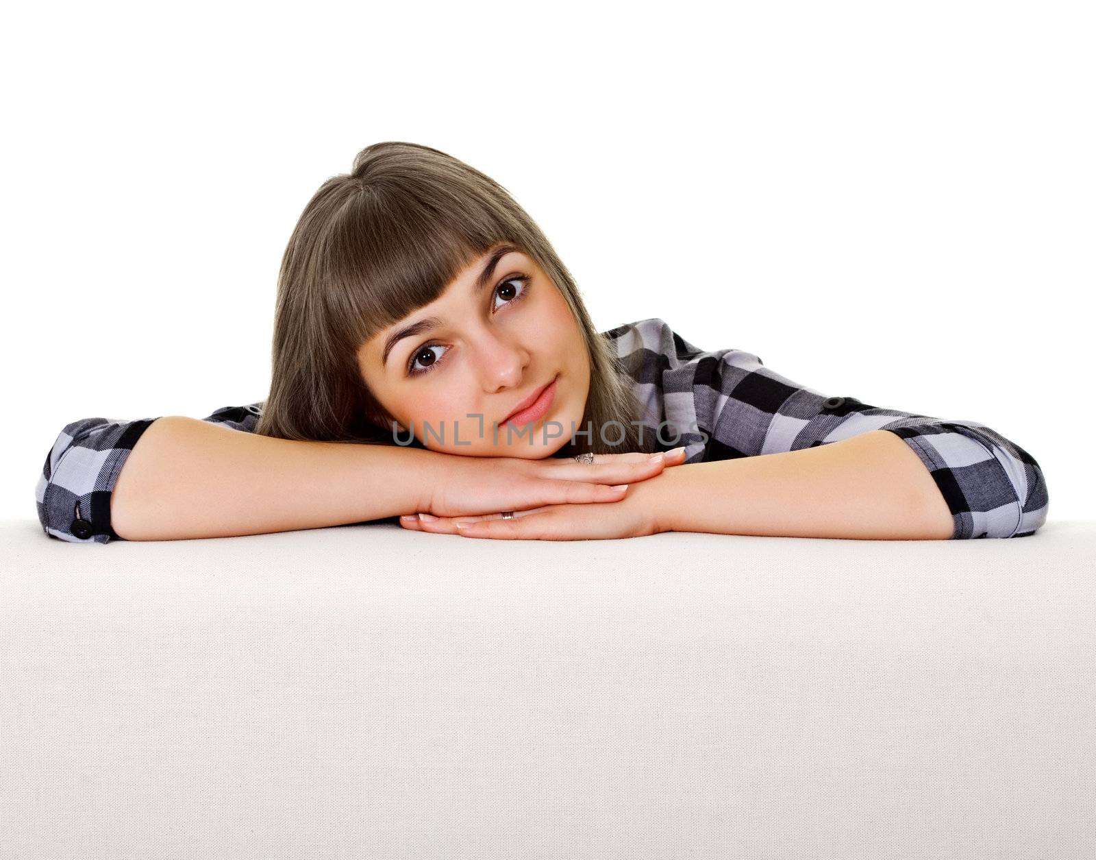 Portrait of a girl in a pensive pose isolated on white background
