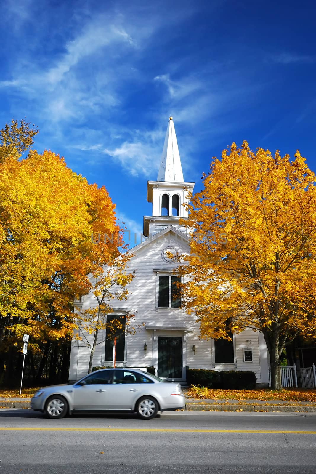 orange Church, tree and car in autumn from New England, USA