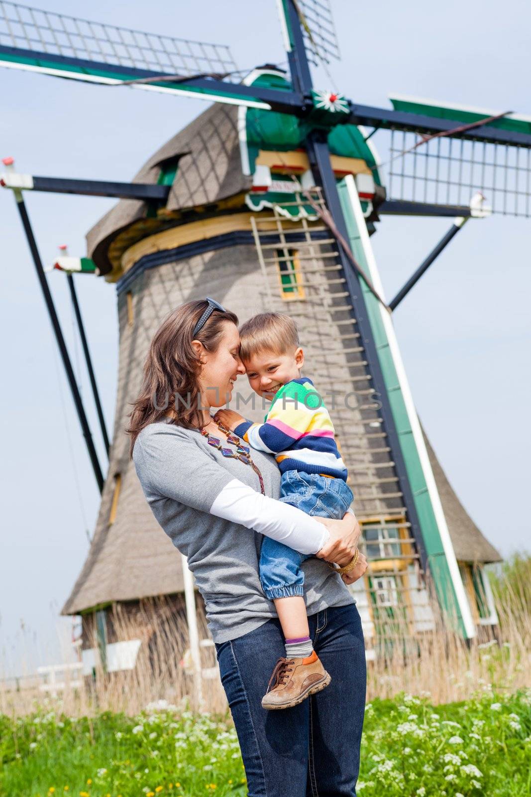 Mother and son near windmill in Holland