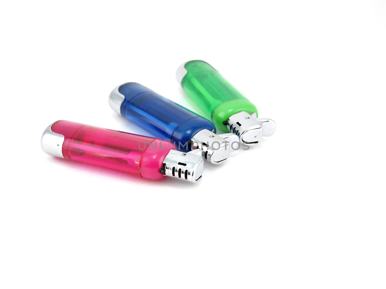 Three color lighters over white