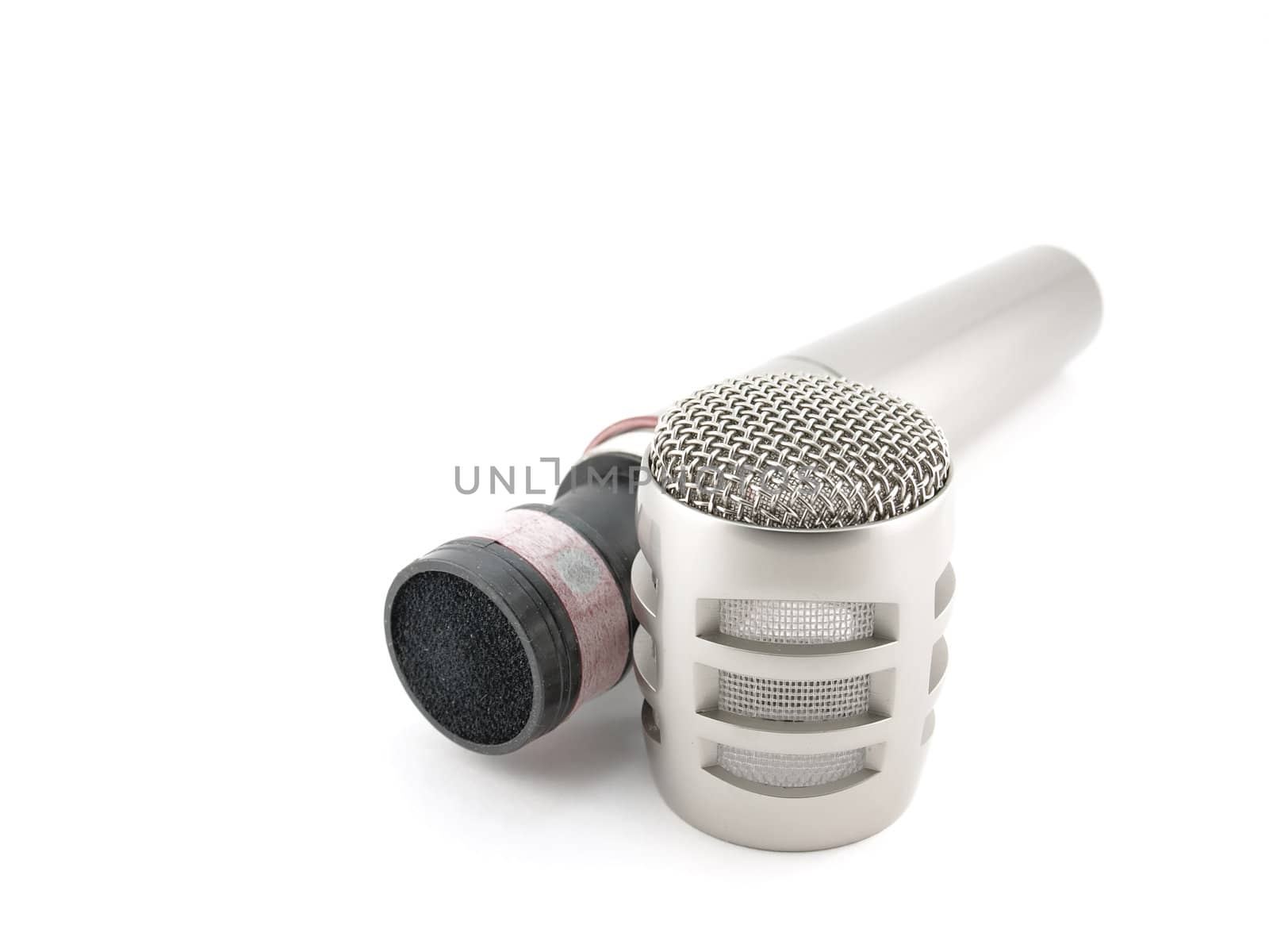 Disassembled microphone over white by sergpet