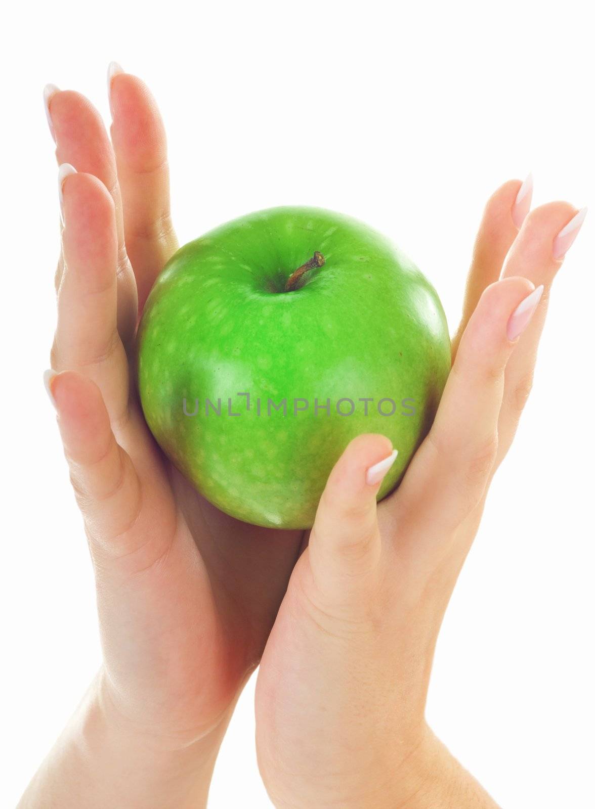 Green fresh apple in beutiful female hands with nice manicure isolated on white background