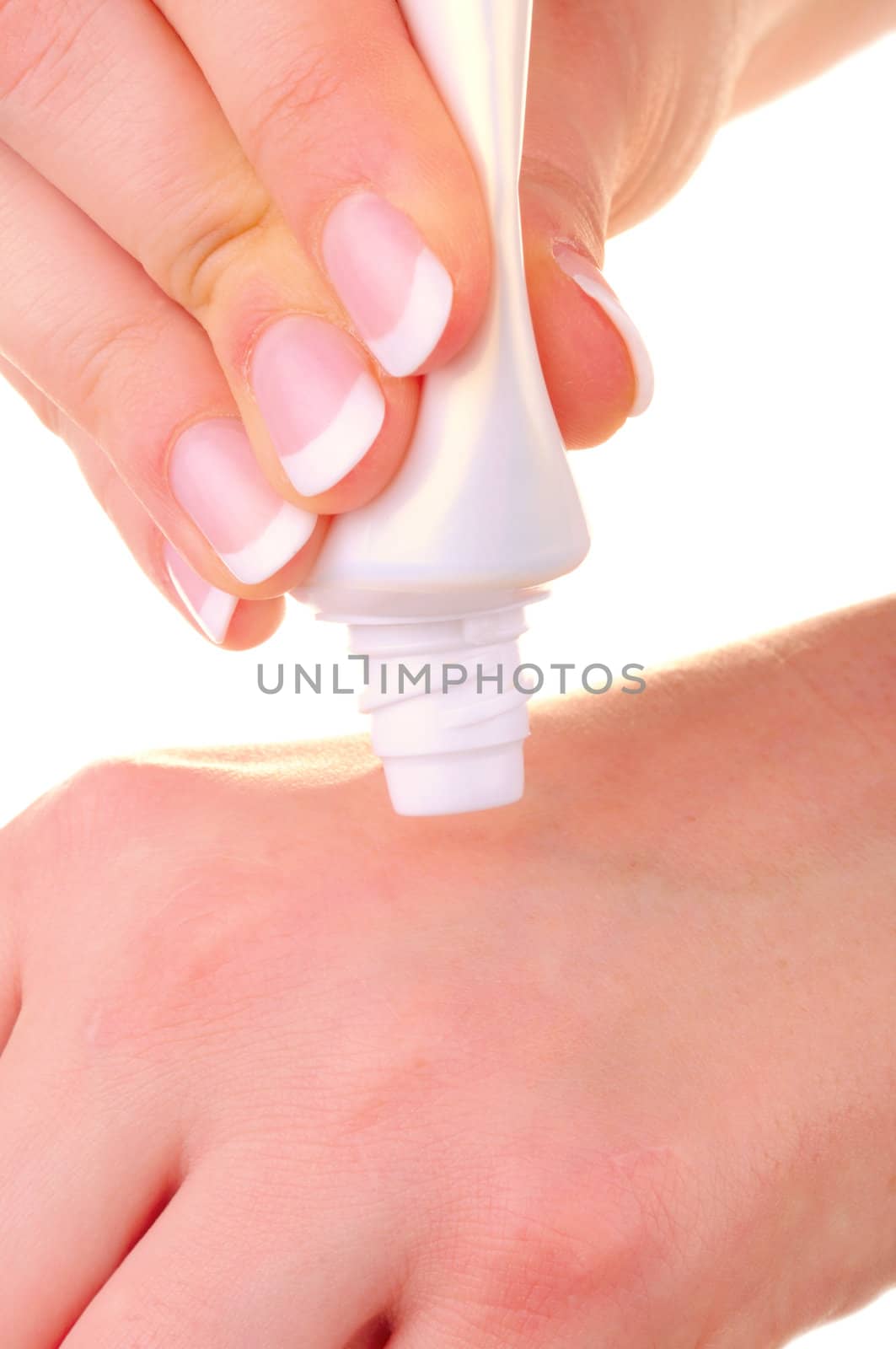 Cream applying on hands by iryna_rasko