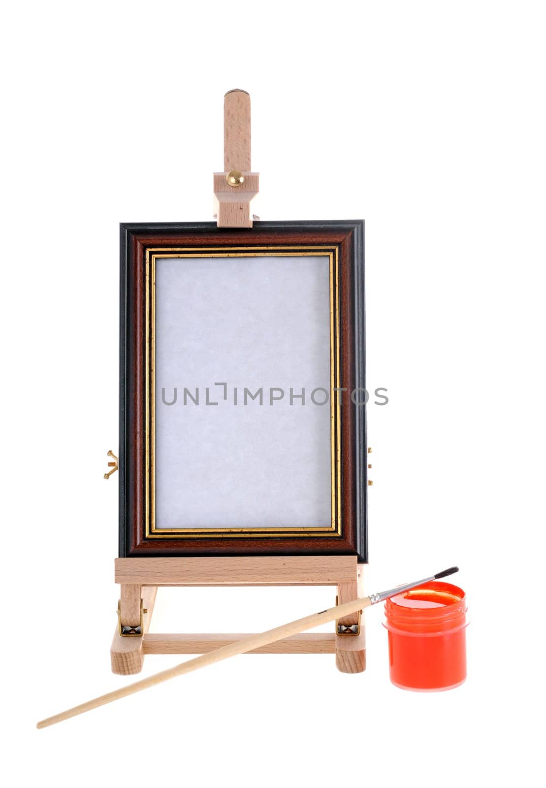 Easel, paint and small brush on white background