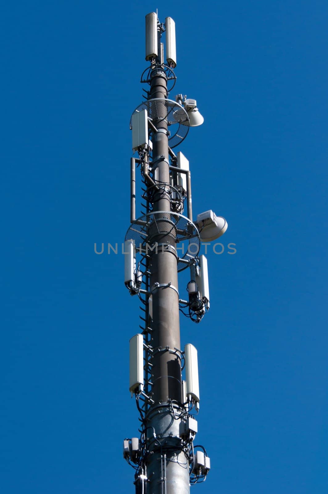 Communication tower with satellite dishes and aerials