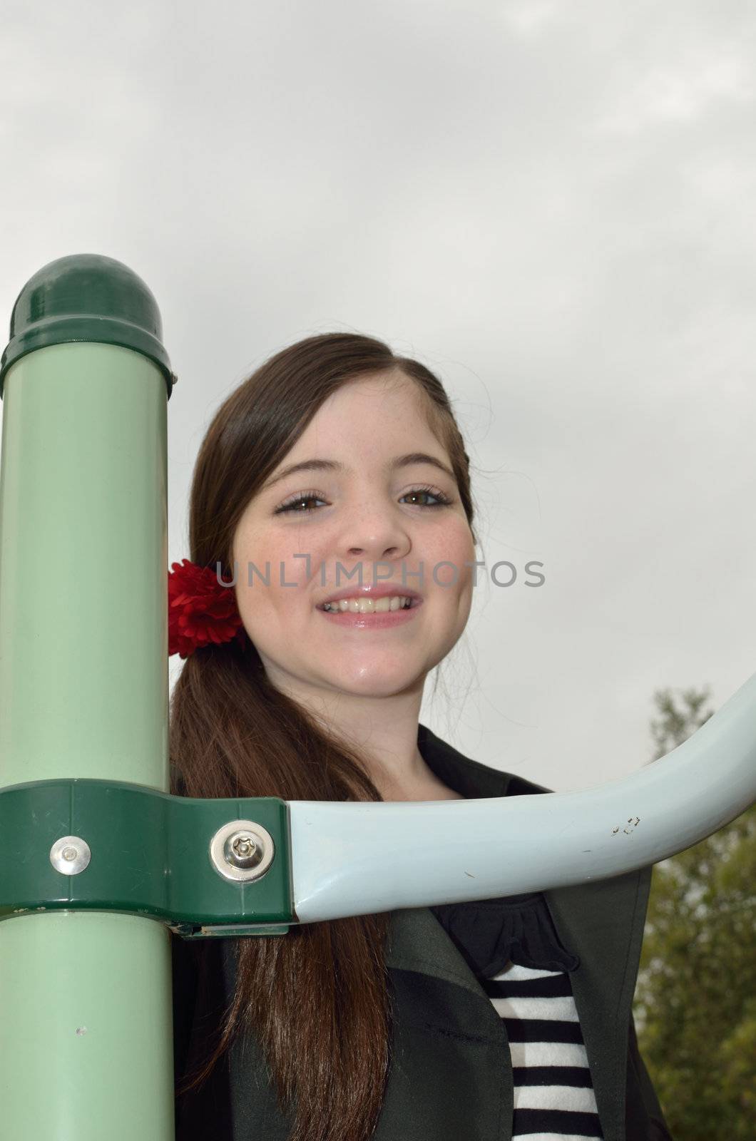 Young girl on the playground equipment