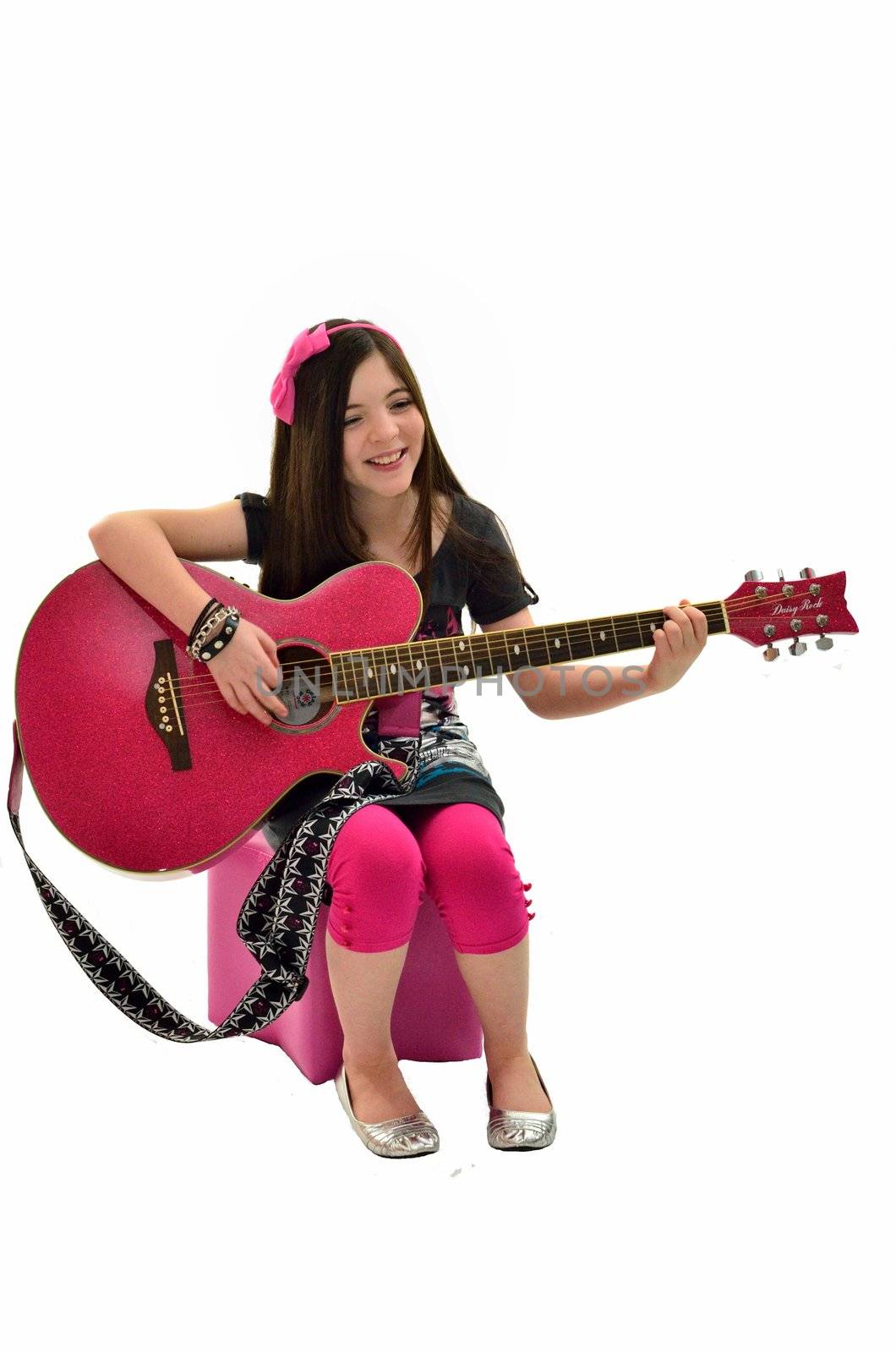 Young performer playing her guitar