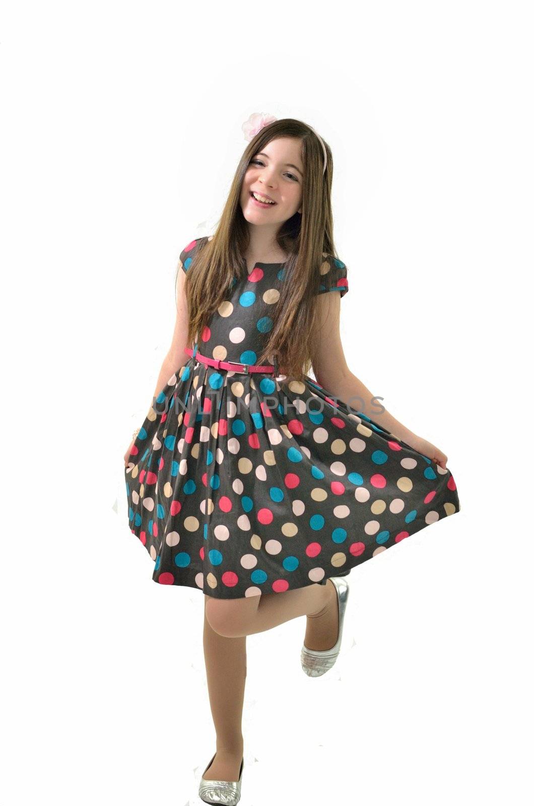 Young girl dancing around in her dress