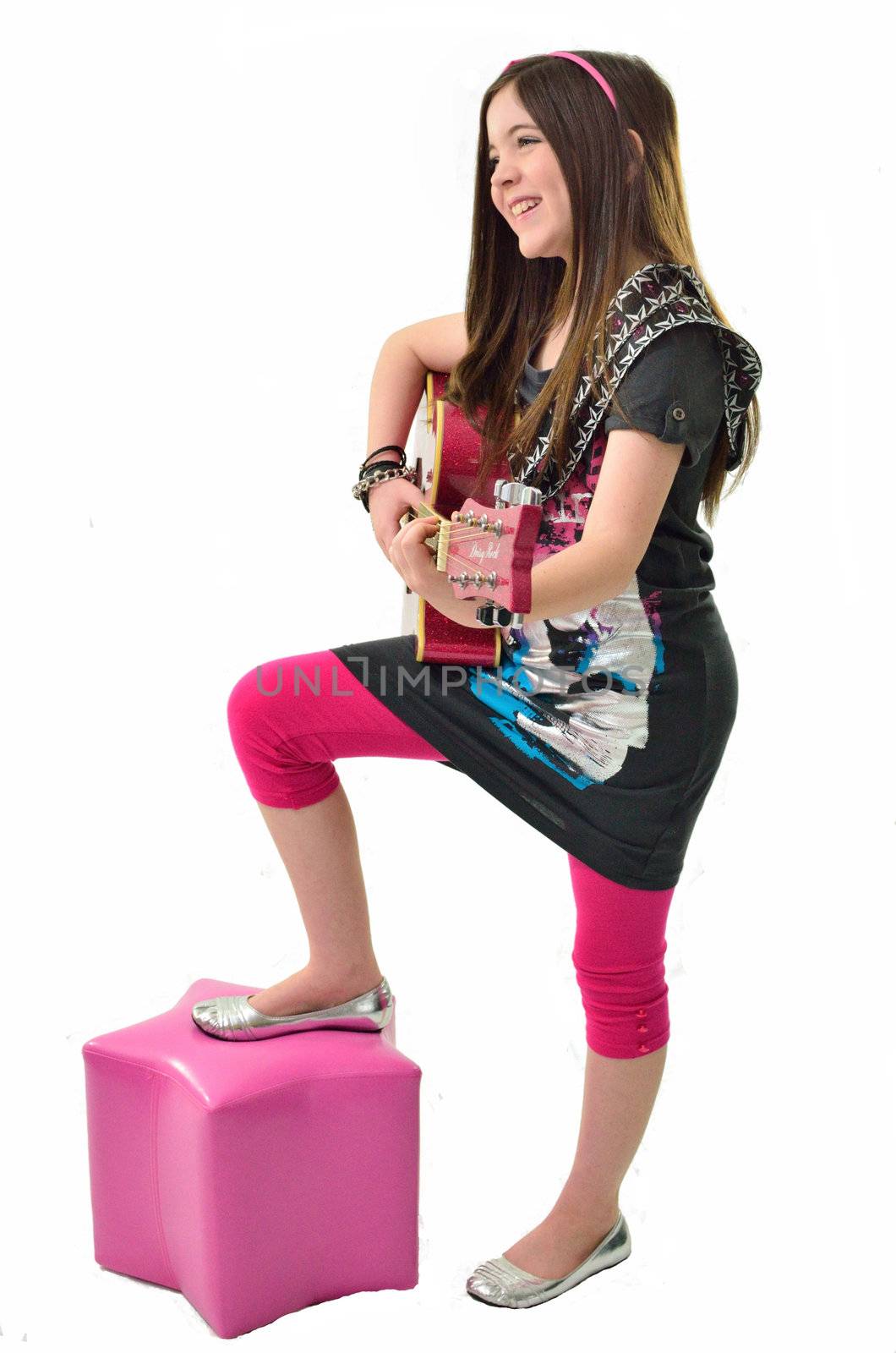 Young performer playing her guitar