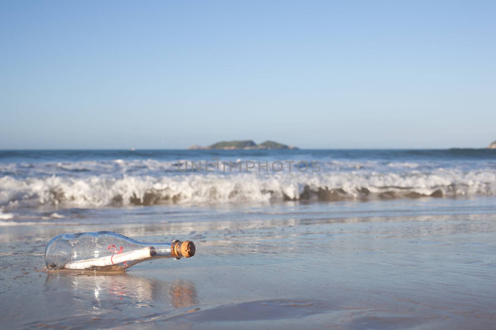 A message inside a glass bottle, washed up on a remote beach.
