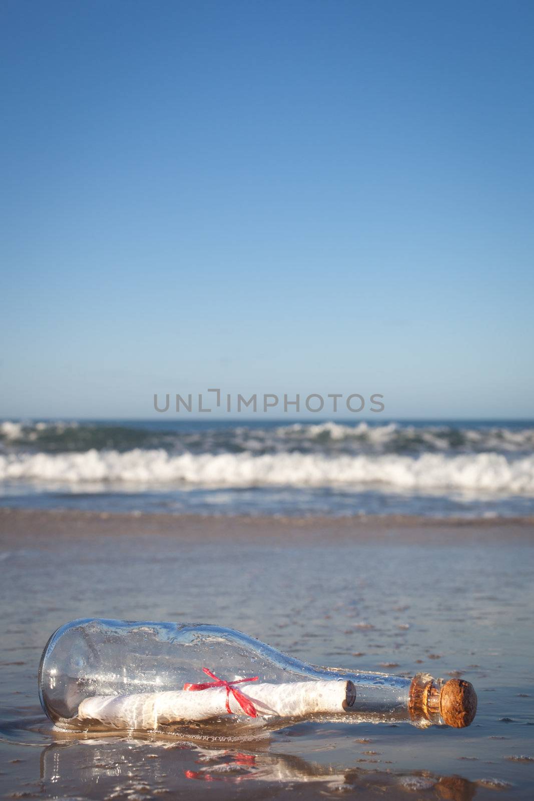 A message inside a glass bottle, washed up on a remote beach.