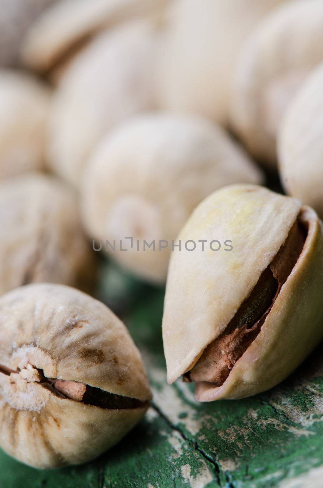 Close up pistachio on grunge wooden table