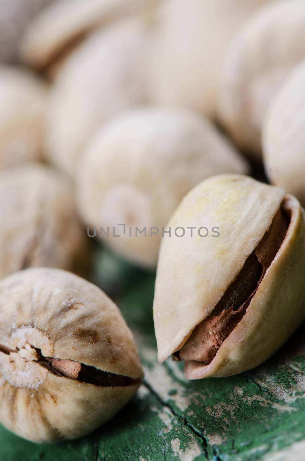 Pistachio on wood by Nanisimova