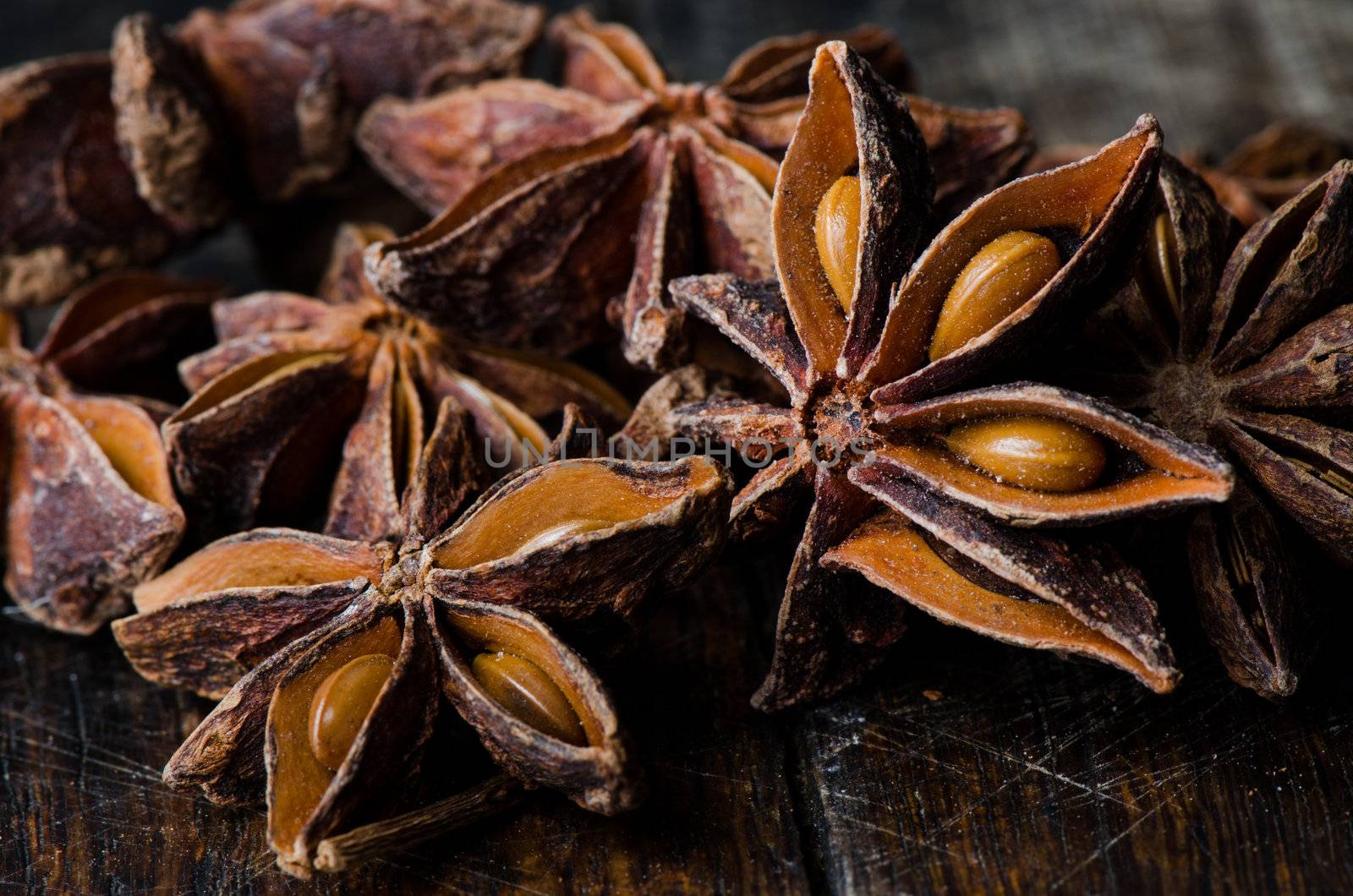 Close up few star anise on dark wooden table
