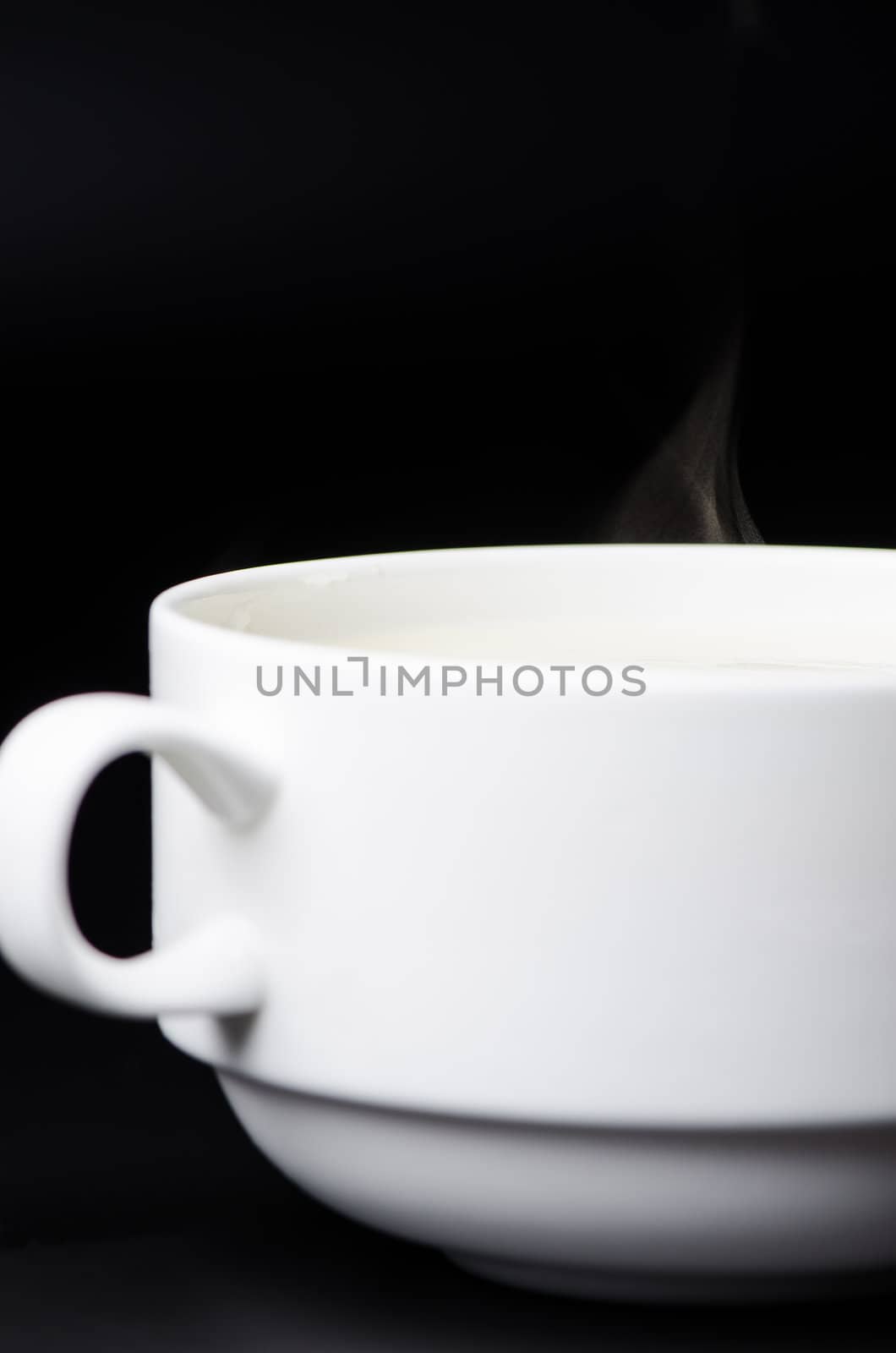 Mashed Potato Soup on black background close up by Nanisimova