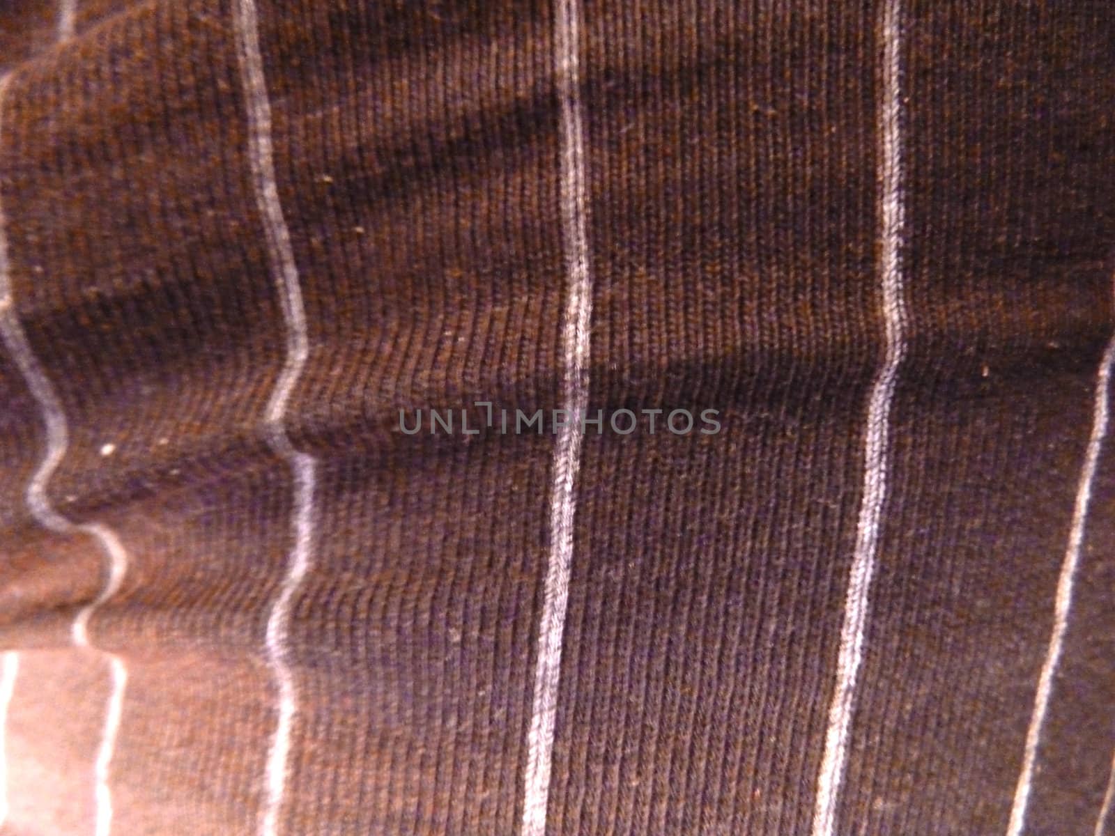 black fabric with white stripes as a background