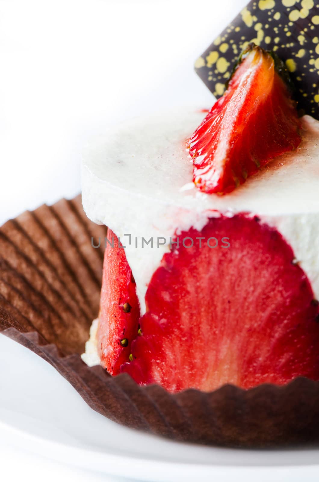 Strawberry cake on white saucer