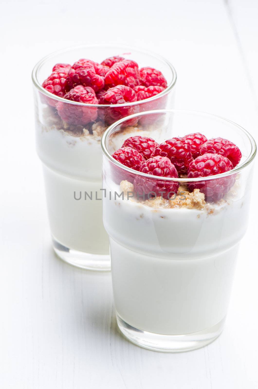 Yogurt with raspberries in a glass