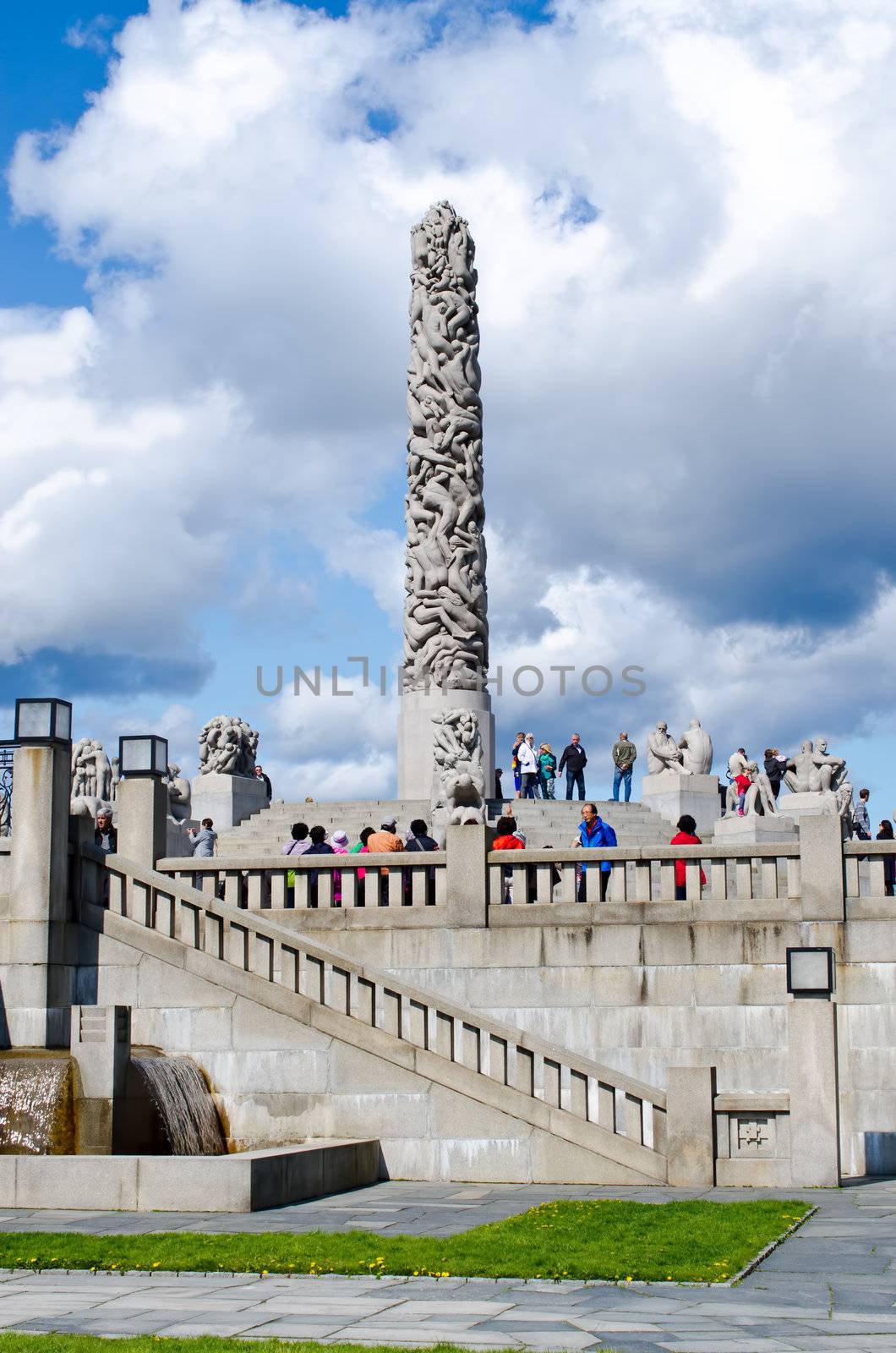 OSLO, NORWAY - MAY16: Visitors enjoying the statues created by Gustav Vigeland in the popular Vigeland park in Oslo, Norway on May 16,  2012