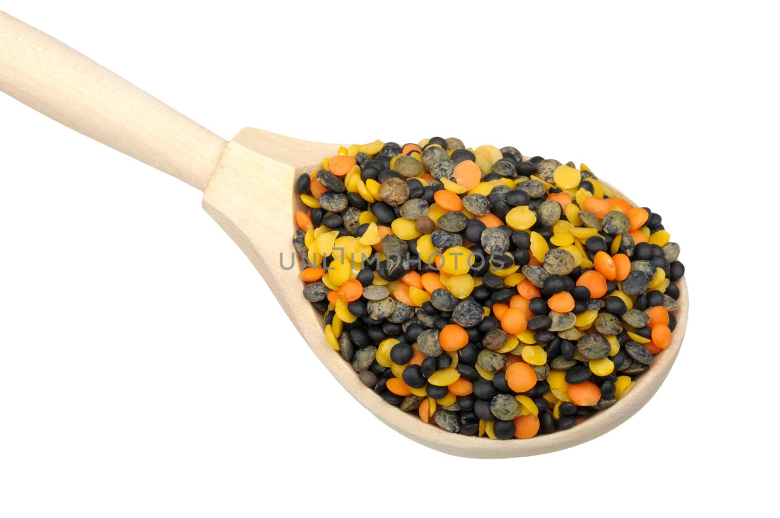 mix of four types of lentils in wooden spoon isolated on white background