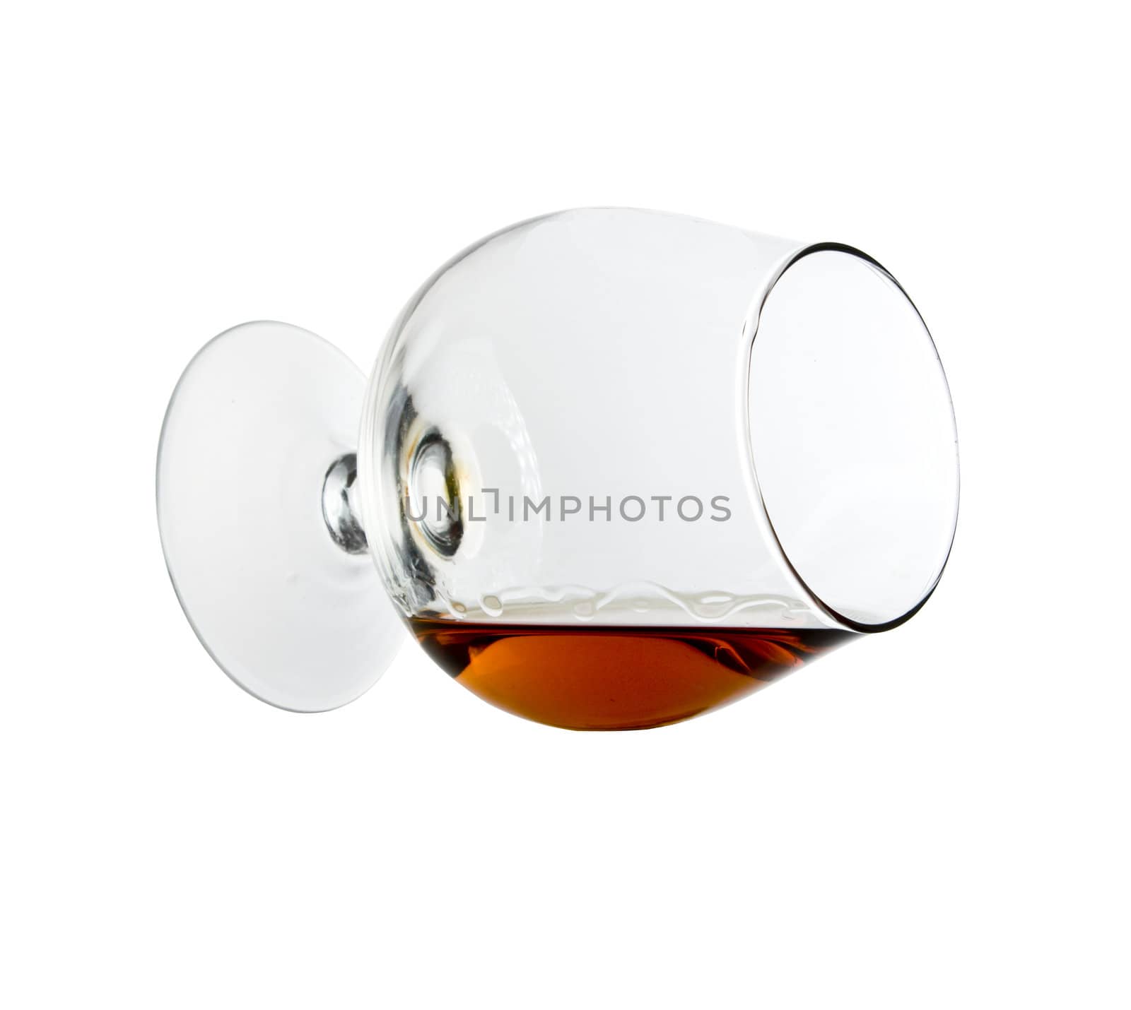 Cognac in the big glass on a white background