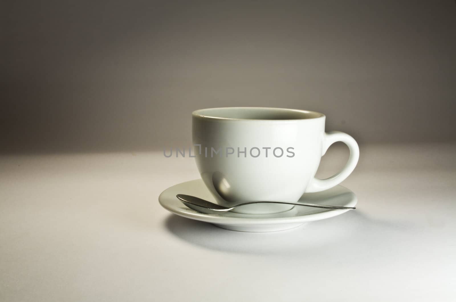 Coffee cup on a grey background. Studio