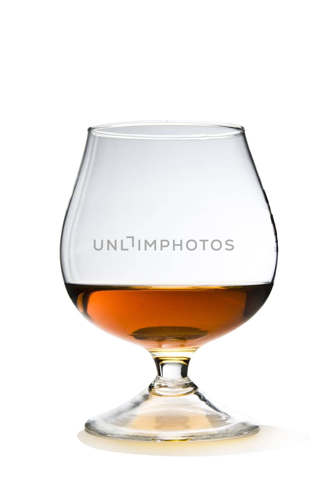 Cognac and Glass Snifter on White with Clipping Path Included.